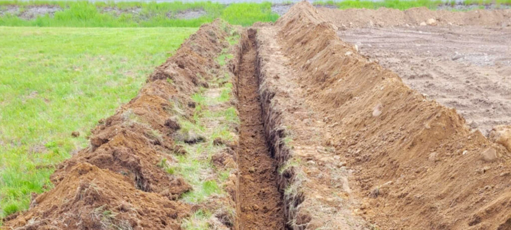 Freshly dug utility trench on a construction site in Coeur d'Alene